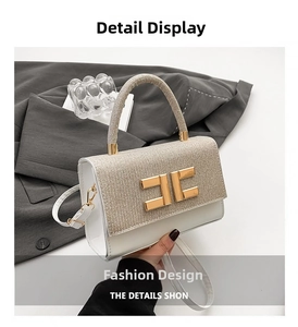 Detail showing white leather texture and glitter flap with gold interlocking metal buckle