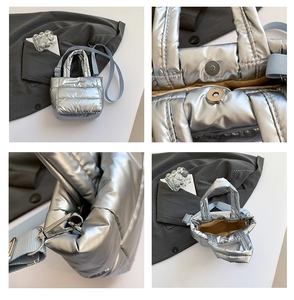 Detail of silver quilted bucket bag with padded handles and adjustable woven strap