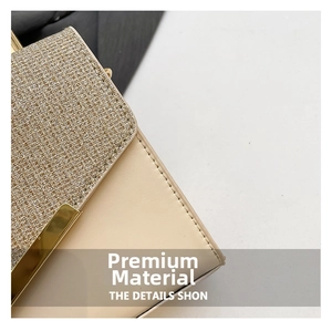 Detail of glitter fabric and beige faux leather on a luxury handbag with gold metal trim