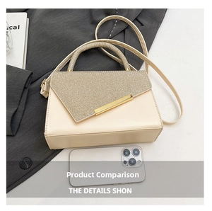 Detail of beige crossbody bag with glitter texture flap and metallic gold bar accent