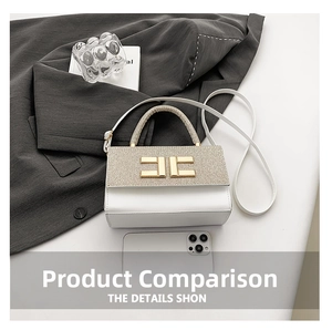 Close-up of white leather handbag with gold glitter flap and metal H-shaped lock