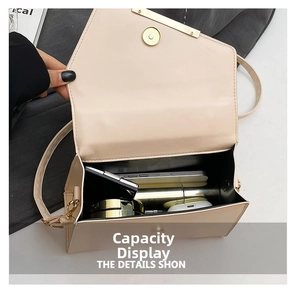 Interior view of beige crossbody bag showing space for phone, lipstick, and cosmetics