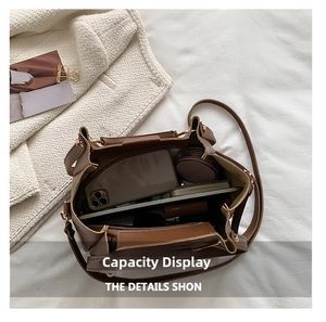 Top-down view showing spacious interior of brown tote bag with phone and cosmetics