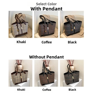 Detail view of khaki brown and black plaid wool totes with leather handles and gold charms