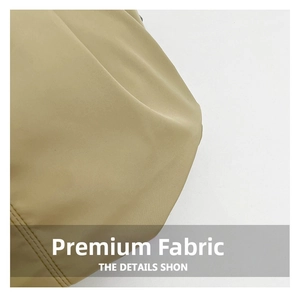 Detailed close-up showing the fine beige fabric texture and double-row stitching on the bag