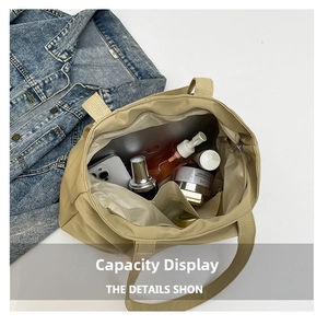 Large capacity tote bag interior with multiple compartments showing ample storage space