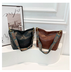 Retro shoulder bucket bags in black and brown with colorful ethnic embroidery wide straps