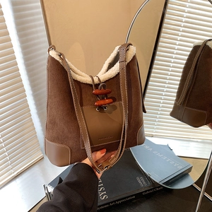 Brown corduroy shoulder bag with faux shearling trim and toggle button for autumn/winter
