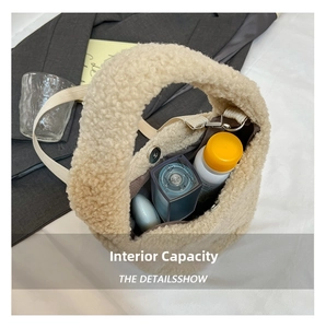 Detail view of the plush beige faux shearling bag showing its large internal storage capacity