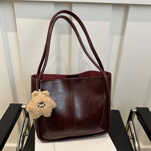 Vintage burgundy leather tote bag with a large capacity and cute star plush charm