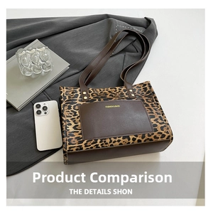 Detail of leopard print tote bag with brown leather pocket and reinforced handles
