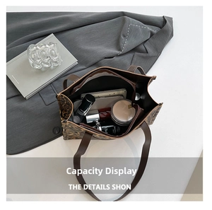 Top-down view of a spacious leopard print tote bag interior with beauty essentials inside