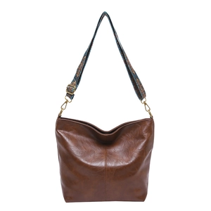 Retro brown PU leather bucket bag with wide colorful jacquard strap and gold hardware