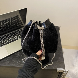 Chic black plush bucket bag with silver metal chain and pearl drawstring details