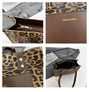 Detail view of leopard print tote bag with zipper closure and fashion text printing