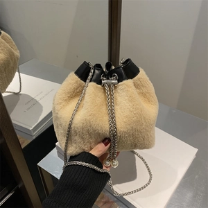 Plush beige bucket bag with pearl drawstring charms and silver chain strap for women