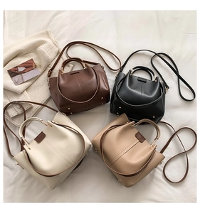 Flat lay view of retro PU tote bags in four colors with circular handles and straps