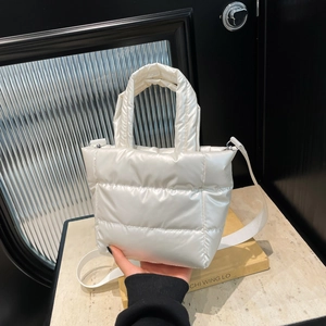 Minimalist white quilted puffer handbag with adjustable shoulder strap for women