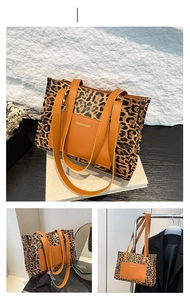 Detail of leopard print canvas and brown leather stitching on a fashion tote bag