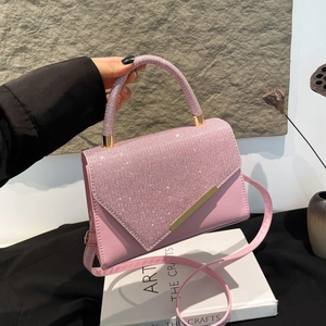 Pink rhinestone handbag with elegant gold hardware and leather crossbody strap for women