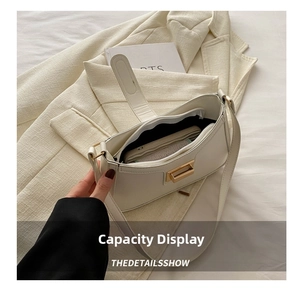 Interior view showing spacious capacity and compartments of white faux leather square bag