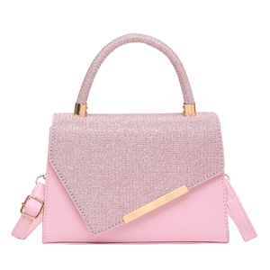 Pink patchwork square handbag with shimmering glitter finish and gold metal accents