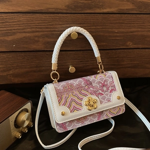 Sac à main vintage avec poignée tressée et fermoir en forme de fleur de prunier