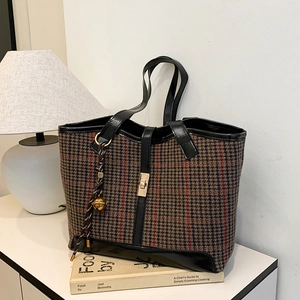 Classic plaid woolen tote bag with black leather trim and golden twist lock closure