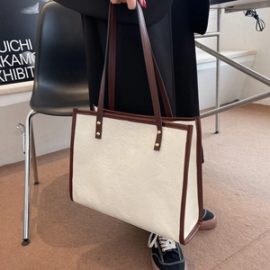 Retro large tote bag in beige with embossed graffiti print and brown contrast handles