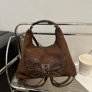 Sac hobo marron en daim avec cordon papillon et bandoulière réglable pratique