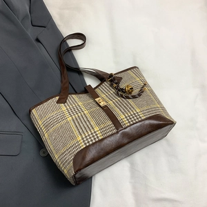 Retro houndstooth tote bag with brown leather straps and gold twist lock for daily commute