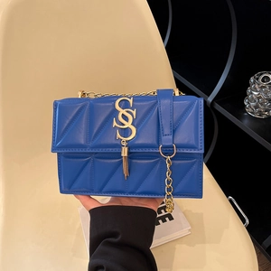 Blue quilted rectangular shoulder bag with golden SS logo and chain tassel detail