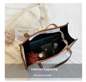 Interior view of large capacity tote bag showing umbrella, wallet and cosmetics