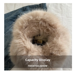 Detail view of the spacious inner compartment of the plush faux fur tote bag