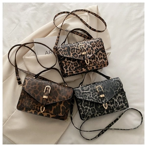 Detailed view of leopard print small square bags in brown, tan and grey color options