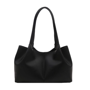 Minimalist black leather tote bag with vertical stitching and large capacity for commuting