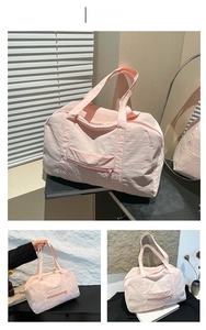 Pink large capacity travel tote bag with reinforced handles and durable nylon texture