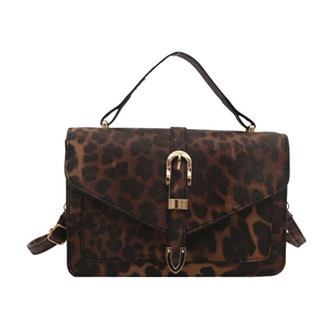 Vintage leopard print square crossbody bag with gold buckle and top handle in brown tones