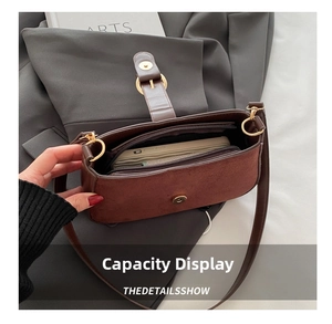 Interior view showing spacious compartments and zip pocket of the brown suede tote
