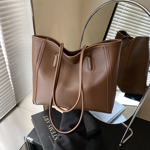 Minimalist large brown tote bag for women made of premium synthetic leather with long straps