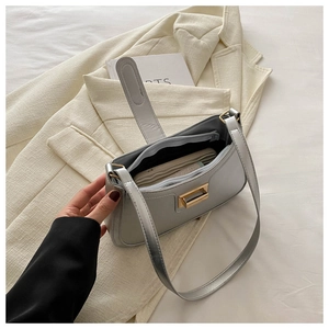 Internal view of light grey shoulder bag showing zipper pocket and spacious storage