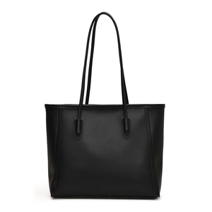 Minimalist black leather tote bag with long shoulder straps for women commuting