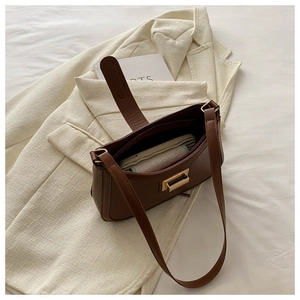 Interior view of vintage brown leather handbag showing spacious compartment for a wallet