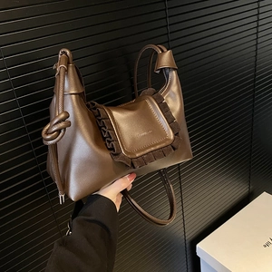 Brown drawstring cloud shoulder bag with ruffled trim and retro pleated leather design