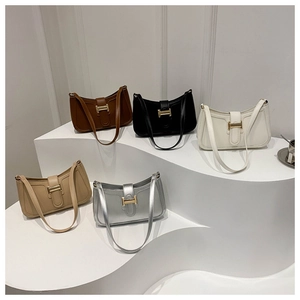 Minimalist square underarm bags in five colors with iconic golden H-shaped metal buckles