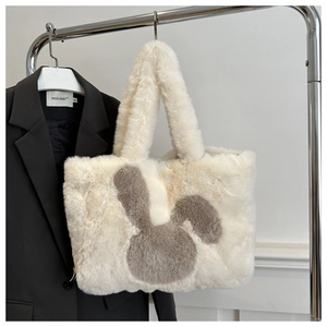 Detailed close-up of the plush rabbit tote bag showing white faux fur and soft texture