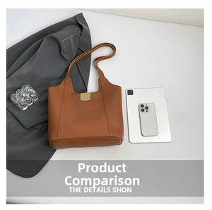 Macro detail showing the large interior capacity and sleek metal buckle of the tote bag