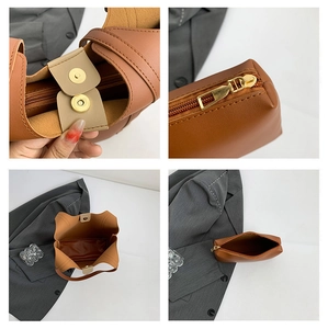 Detail view of brown leather tote set with magnetic buckle and inner zipper pouch