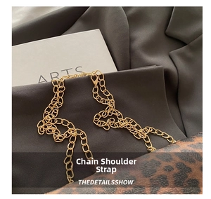 Detail view of the elegant golden metal chain strap on a leopard print shoulder bag