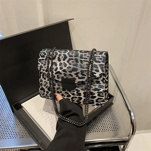 Fashionable leopard print chain crossbody bag with metal lock and gray strap